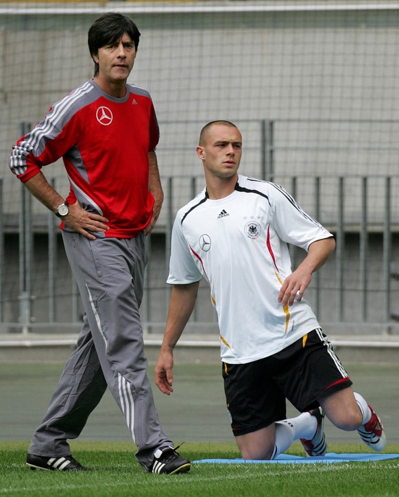 ** FILE ** In this Aug. 20, 2007 file photo, coach of German national football team Joachim Loew, left, and defender Christian Pander are seen during a training session in Frankfurt, central Germany.  ...