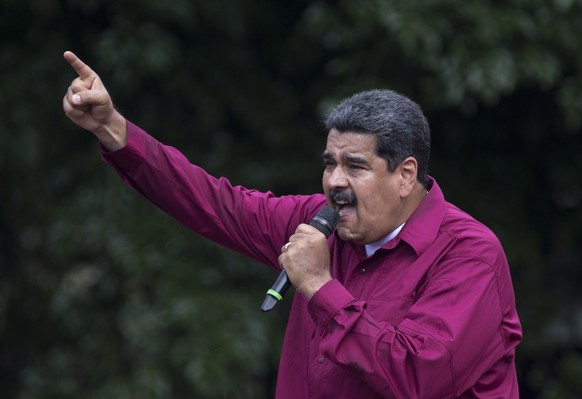 Venezuela&#039;s President Nicolas Maduro speaks to supporters during a rally marking May Day in Caracas, Venezuela, Tuesday, May 1, 2018. Government workers marched today marking the workers&#039; ho ...