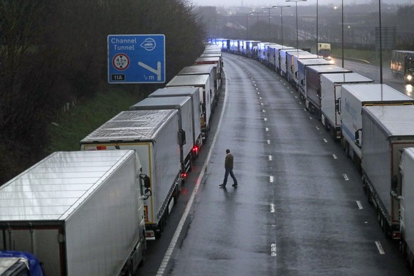 Lorries are parked on the M20 near Folkestone, Kent, England as part of Operation Stack after the Port of Dover was closed and access to the Eurotunnel terminal suspended following the French governme ...