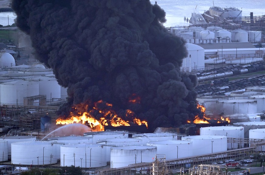 Firefighters battle a petrochemical fire at the Intercontinental Terminals Company Monday, March 18, 2019, in Deer Park, Texas. The large fire at a Houston-area petrochemicals terminal will likely bur ...