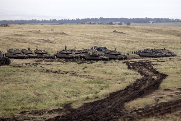 epa06722692 A general view of Israeli Merkava tanks deployed near the Israeli-Syrian border in the Golan Heights, 09 May 2018. Tensions have increased between Israel and Syria after Damascus accused I ...