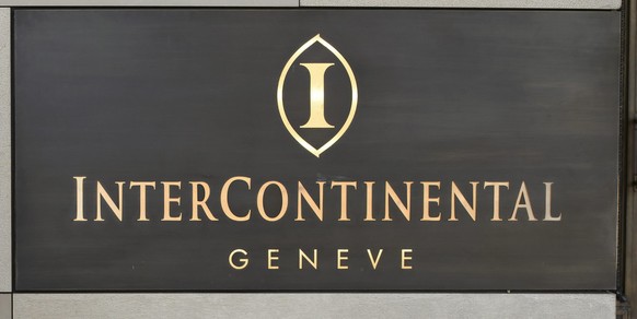 epa04169774 An armed Swiss police officer controls the area in front of the Intercontinental Geneve hotel, where the meeting between the United States, Ukraine, Russia and the European Union takes pla ...