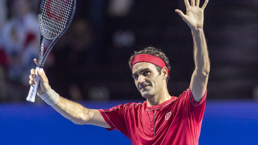 Switzerland&#039;s Roger Federer cheers after winning his first round match against Germany&#039;s Peter Gojowczyk at the Swiss Indoors tennis tournament at the St. Jakobshalle in Basel, Switzerland,  ...