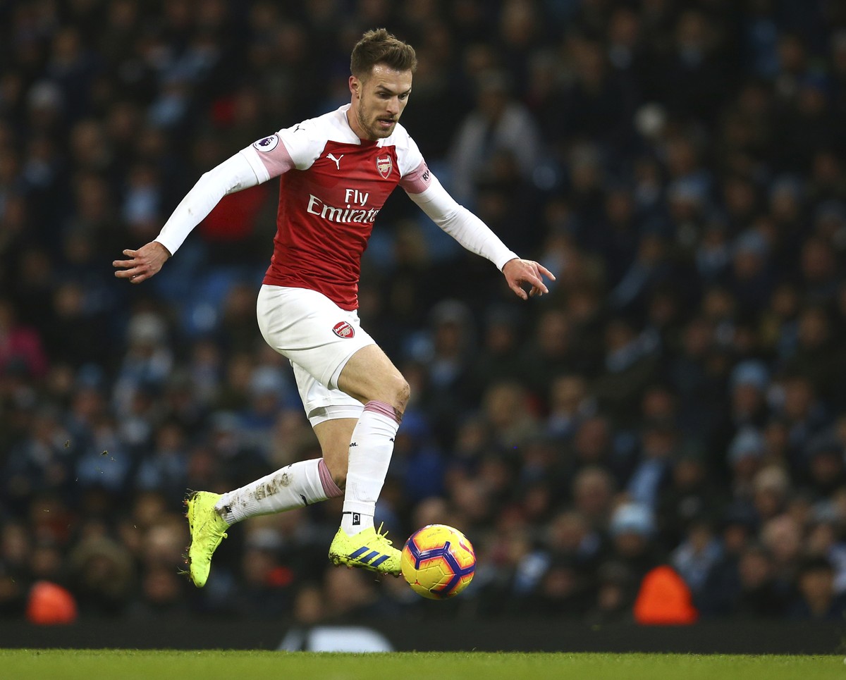 Arsenal's Aaron Ramsey controls the ball during the English Premier League soccer match between Manchester City and Arsenal at Etihad stadium in Manchester, England, Sunday, Feb. 3, 2019. (AP Pho ...