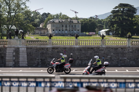 Police on motorcycles pass the Villa La Grange where the US - Russia summit between US President Joe Biden and Russian President Vladimir Putin is scheduled to hasppen later today, in Geneva, Switzerl ...