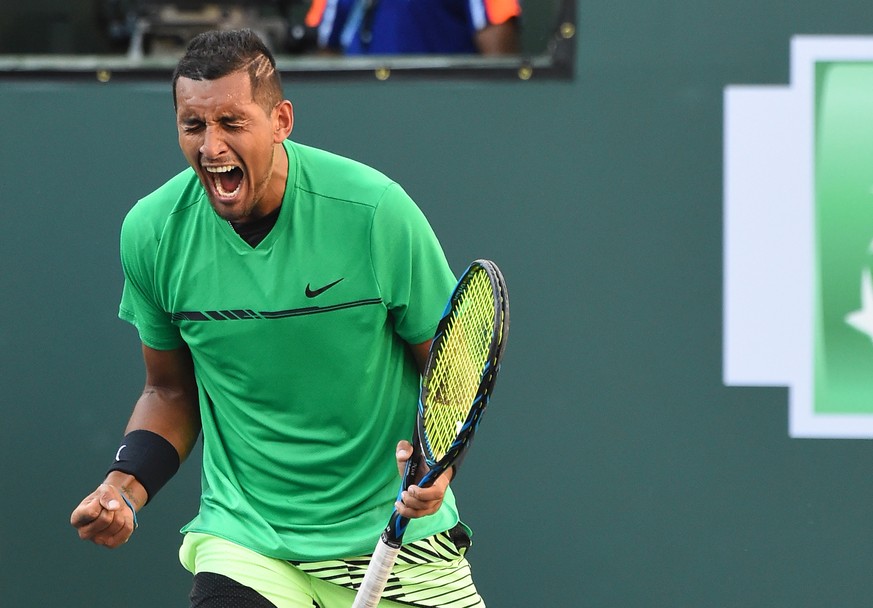 Mar 15, 2017; Indian Wells, CA, USA; Nick Kyrgios (AUS) reacts at match point as he defeats Novak Djokovic in the BNP Paribas Open at the Indian Wells Tennis Garden. Mandatory Credit: Jayne Kamin-Once ...