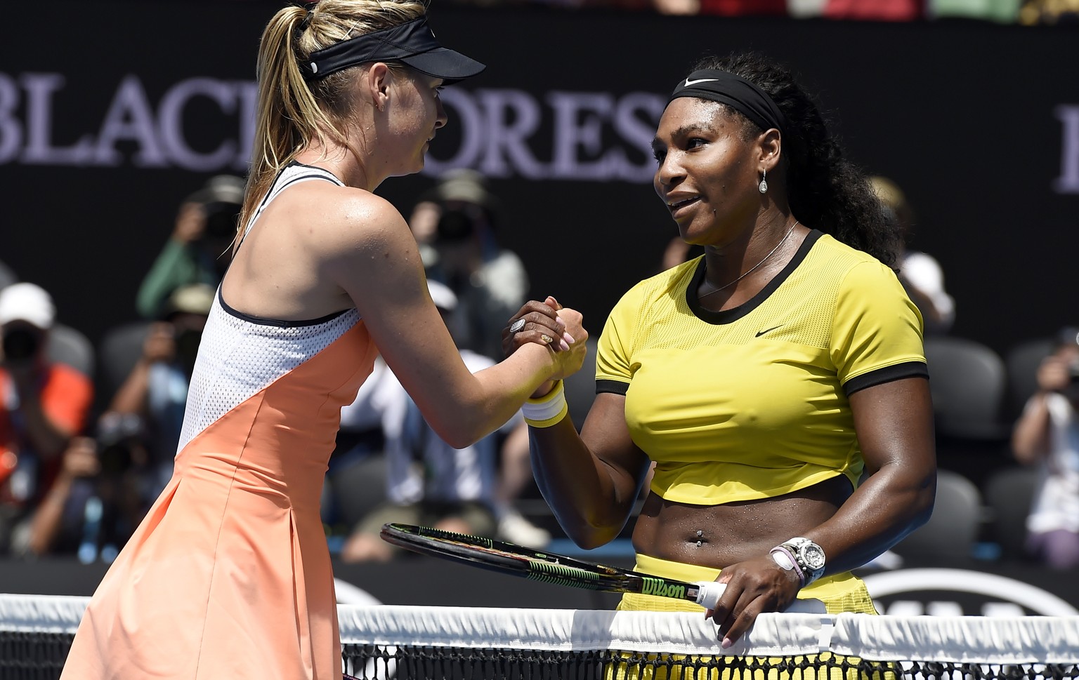 FILE - In this Jan. 26, 2016, file photo, Serena Williams, right, of the United States is congratulated by Maria Sharapova of Russia after winning their quarterfinal match at the Australian Open tenni ...