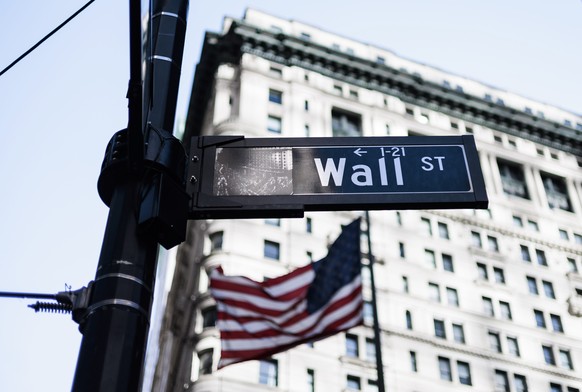 epa10508336 A sign for Wall Street near the New York Stock Exchange in New York, New York, US, March 7, 2023. The Dow Jones industrial average lost 574 points on March 7 following comments from the US Fed...