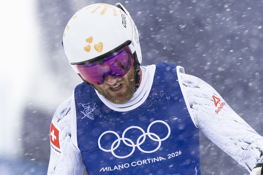 Alex Fiva of Switzerland reacts in the finish area during the men's Freestyle Skiing Ski Cross Big Final at the 2026 Olympic Winter Games in Livigno, Italy, on Saturday, February 21, 2026. (KEYST ...