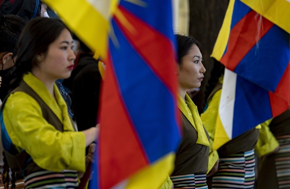 Exile Tibetan artists wait to welcome dignitaries as they gather to mark the anniversary of the 1959 Lhasa uprising in Dharmsala, India, Thursday, March 10, 2022. Hundreds of Tibetans had come out to  ...