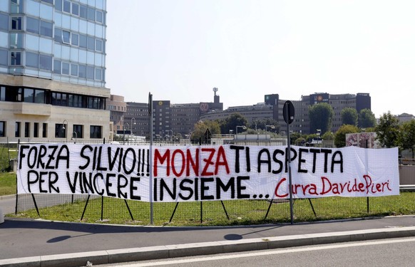 epa08648499 The banner that reads: &#039;Force Silvio!!! Monza is waiting for you to win together...&#039;, signed Curva Davide Pieri (a sector of the stadium where the AC Monza football team of which ...