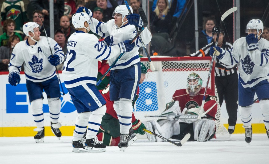 Oct 20, 2016; Saint Paul, MN, USA; Toronto Maple Leafs forward Auston Matthews (34) celebrates his goal with defenseman Nikita Zaitsev (22) during the second period against the Minnesota Wild at Xcel  ...