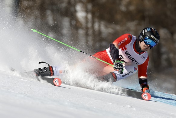epa12588975 Livio Simonet of Switzerland in action during the 1st run of the Men's Giant Slalom race at the FIS Alpine Skiing World Cup in Val d'Isere, France, 13 December 2025. EPA/SEBASTIE ...