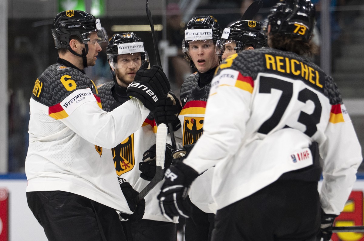 Germany's Joshua Samanski, third from right, celebrates with the team after scoring the second goal during the 2026 IIHF Men's Ice Hockey World Championship preliminary round group A game be ...