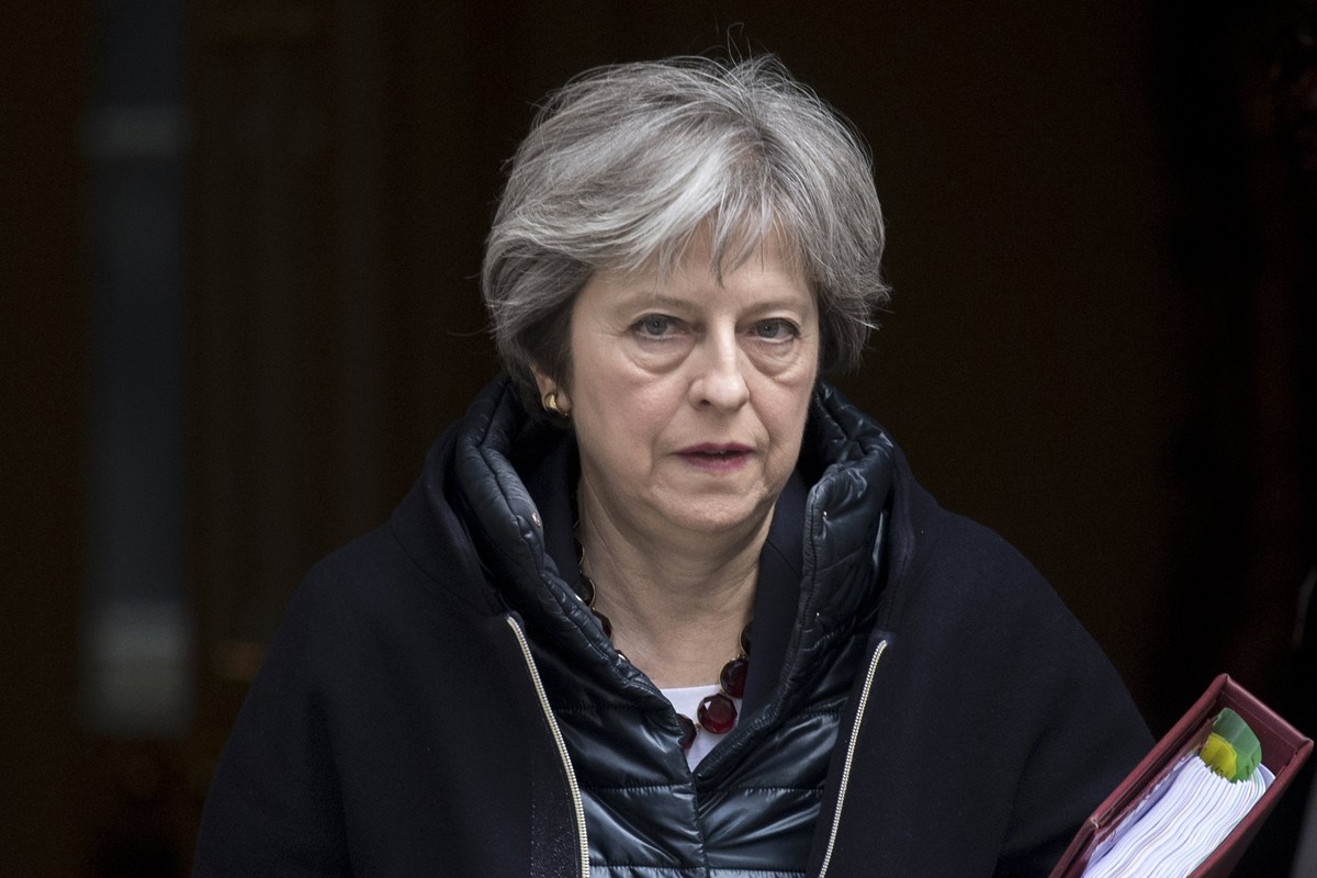 epaselect epa06603131 Britain's Prime Minister Theresa May leaves No. 10 Downing Street to attend the Prime Minister's Questions in the Houses of Commons, in London, Britain, 14 March 2018.  ...