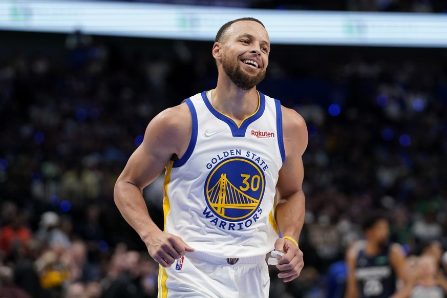 Golden State Warriors guard Stephen Curry (30) reacts after making a 3-point basket during the first half against the Dallas Mavericks in Game 3 of the NBA basketball playoffs Western Conference final ...