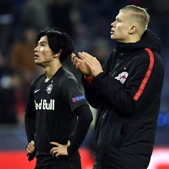 epa08060857 Takumi Minamino of FC Salzburg (L) and Erling Haaland of FC Salzburg (R) react after the UEFA Champions League group E soccer match between FC Salzburg and Liverpool FC in Salzburg, Austri ...