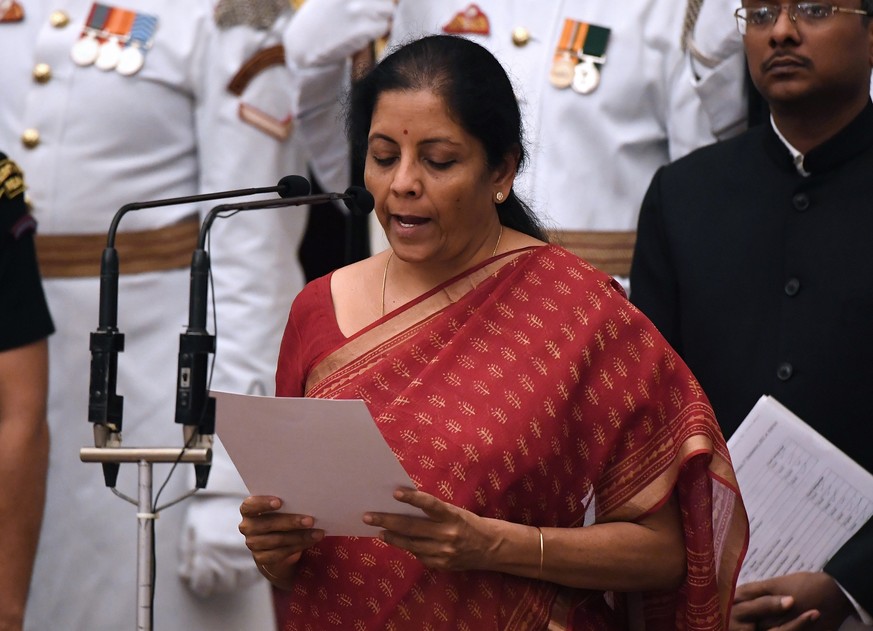 Bharatiya Janata Party (BJP) politician and member of parliament Nirmala Sitharaman takes the oath during the swearing-in ceremony of new ministers at the Presidential Palace in New Delhi, India, Sund ...