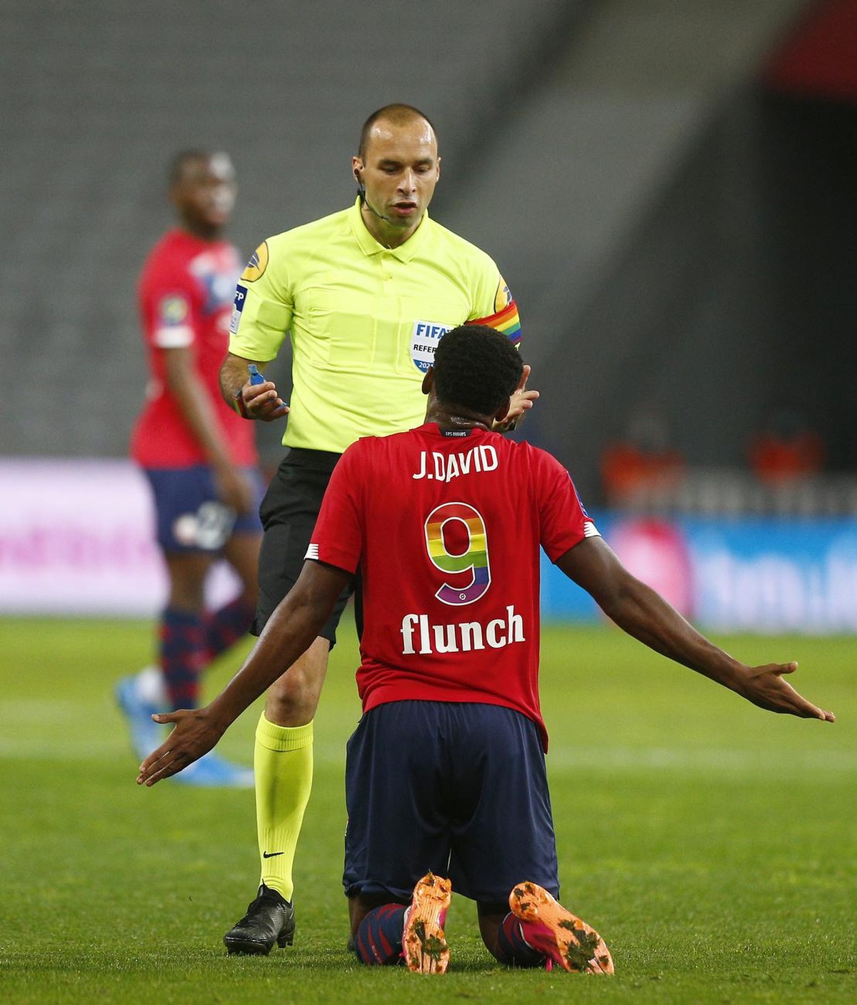 Referee Jerome Brisard reacts to Lille's Jonathan David who gestures towards the referee during the French League One soccer match between Lille and Saint-Etienne in Lille, France, Sunday, May 16 ...