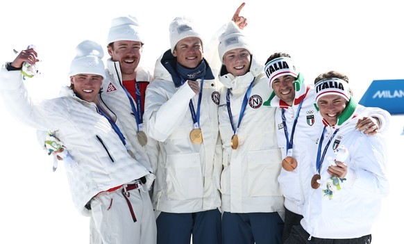 epa12753449 (L-R) Silver medalists Ben Ogden of United States and Gus Schumacher of United States, gold medalists Johannes Hoesflot Klaebo of Norway and Einar Hedegart of Norway, bronze medalists Elia ...