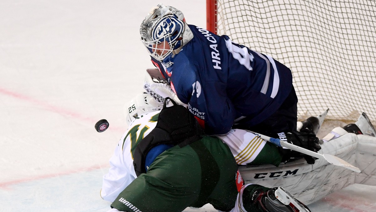 Ambri's goalkeeper Dominik Hrachovina right, fights for the puck with Färjestad's player Martin Johansson left, during the round game of Champions Hockey League between HC Ambri Piotta and B ...