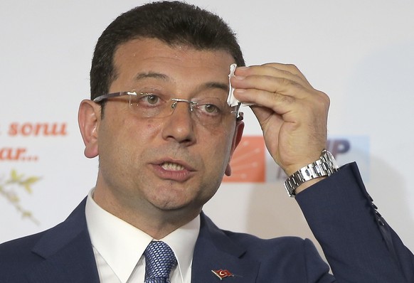 FILE -Ekrem Imamoglu, mayoral candidate for Istanbul of Republican People's Party (CHP) wipes sweat off his forehead during a press conference after the local elections, in Istanbul, March 31, 20 ...