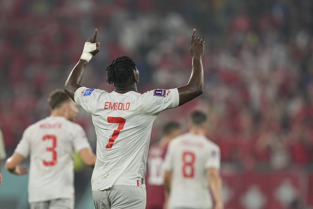 Switzerland's Breel Embolo celebrates after scoring his side's second goal during the World Cup group G soccer match between Serbia and Switzerland, at the Stadium 974 in Doha, Qatar, Friday ...