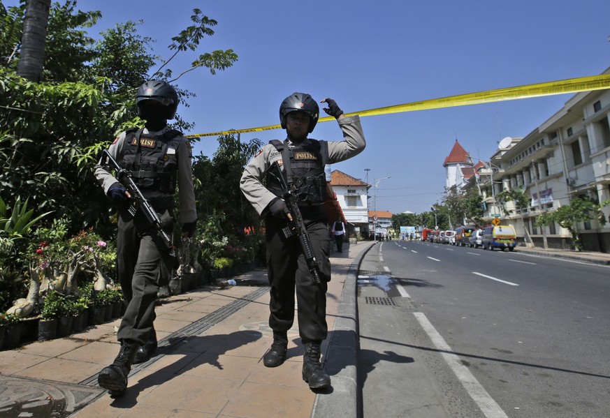 Officers patrol near the local police headquarters following an attack in Surabaya, East Java, Indonesia, Monday, May 14, 2018. The police headquarters in Indonesia&#039;s second largest city was atta ...