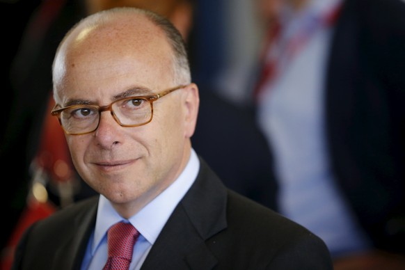 French Interior minister Bernard Cazeneuve is seen before the start of Le Mans 24-hour sportscar race in Le Mans, central France, June 13, 2015. REUTERS/Stephane Mahe