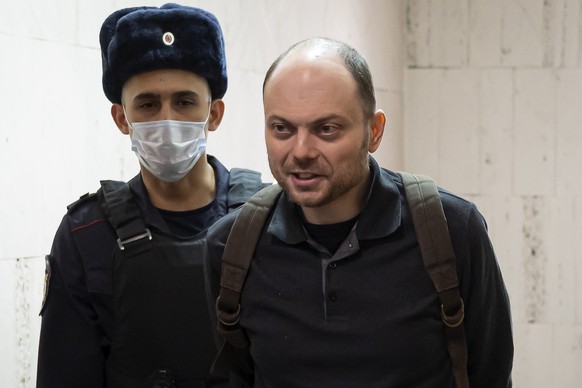 FILE - Russian opposition activist Vladimir Kara-Murza is escorted to a hearing in a court in Moscow, Russia, Feb. 8, 2023. Kara-Murza, an opposition politician, was charged with treason in 2022 after ...
