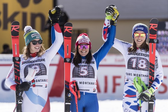 The first three of the race, from left, Michelle Gisin of Switzerland as second, Federica Brignone of Italy as the winner and Petra Vlhova of Slovakia as third, celebrate in the finish area during the ...