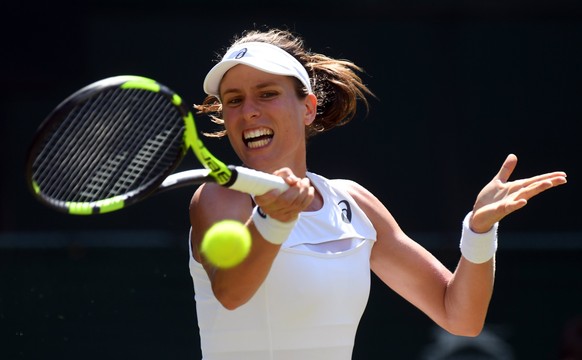 epa06067510 Johanna Konta of Britain returns to Donna Vekic of Croatia in their second round match during the Wimbledon Championships at the All England Lawn Tennis Club, in London, Britain, 05 July 2 ...