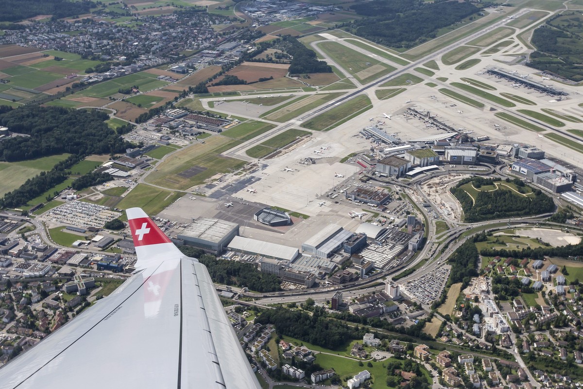 epa05411198 Aerial view from the new Bombardier C-Series CS100 airplane of the airline SWISS on the occasion of the aircraft's baptism, over the Zurich Airport, in Kloten, Switzerland, 06 July 20 ...