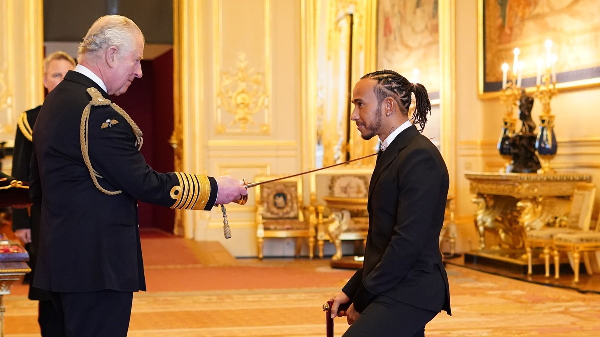 Lewis Hamilton is made a Knight Bachelor by Britain's Prince Charles at Windsor Castle, in Windsor, England, Wednesday, Dec. 15, 2021. (Dominic Lipinski/PA via AP)