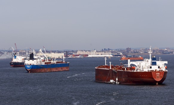 epa07268334 Cargo ships gather in New York harbor, in New York, New York, USA, 07 January 2019. The United States and China are scheduled to begin a first round of trade negotiations on 07 January in  ...