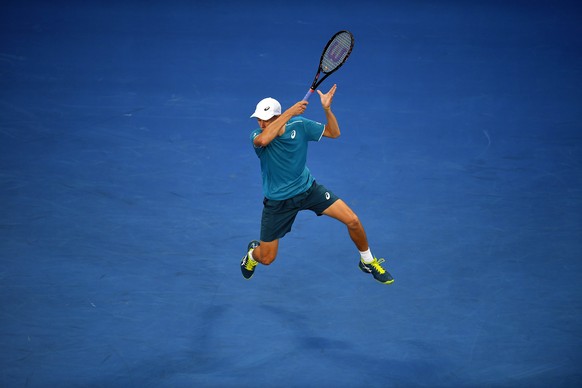 epa06442587 Alex de Minaur of Australia in action during his first round match against Tomas Berdych of the Czech Republic at the Australian Open tennis tournament, in Melbourne, Victoria, Australia,  ...