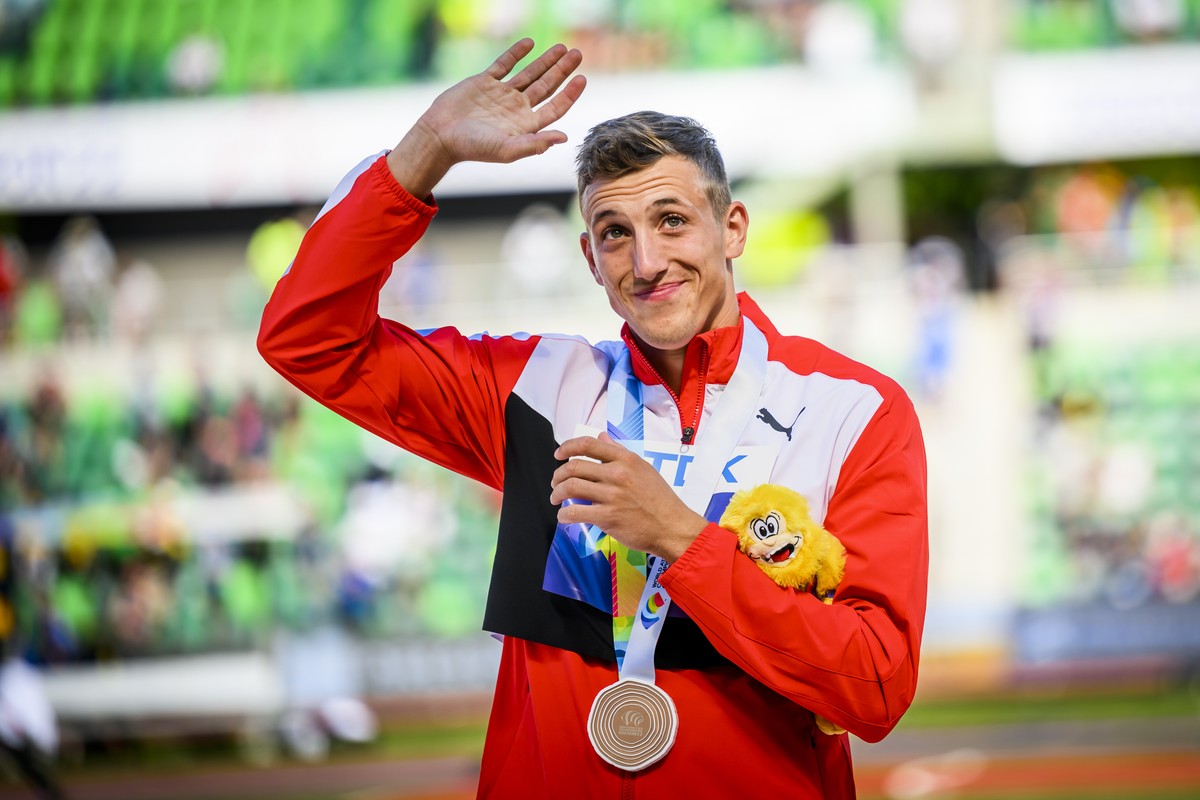 Bronze medalist Simon Ehammer of Switzerland celebrates for the men's long jump podium ceremony during the IAAF World Athletics Championships, at the Hayward Field stadium, in Eugene, United Stat ...