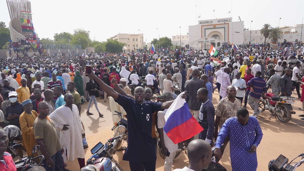 Nigeriens, some holding Russian flags, participate in a march called by supporters of coup leader Gen. Abdourahmane Tchiani in Niamey, Niger, Sunday, July 30, 2023. Not everyone is hostile to last wee ...
