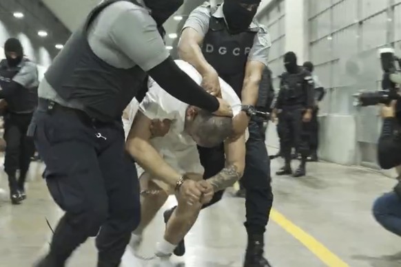 In this undated photo provided by the U.S. District Court for the District of Maryland, a man identified by Jennifer Vasquez Sura as her husband, Kilmar Abrego Garcia, is led by force by guards throug ...