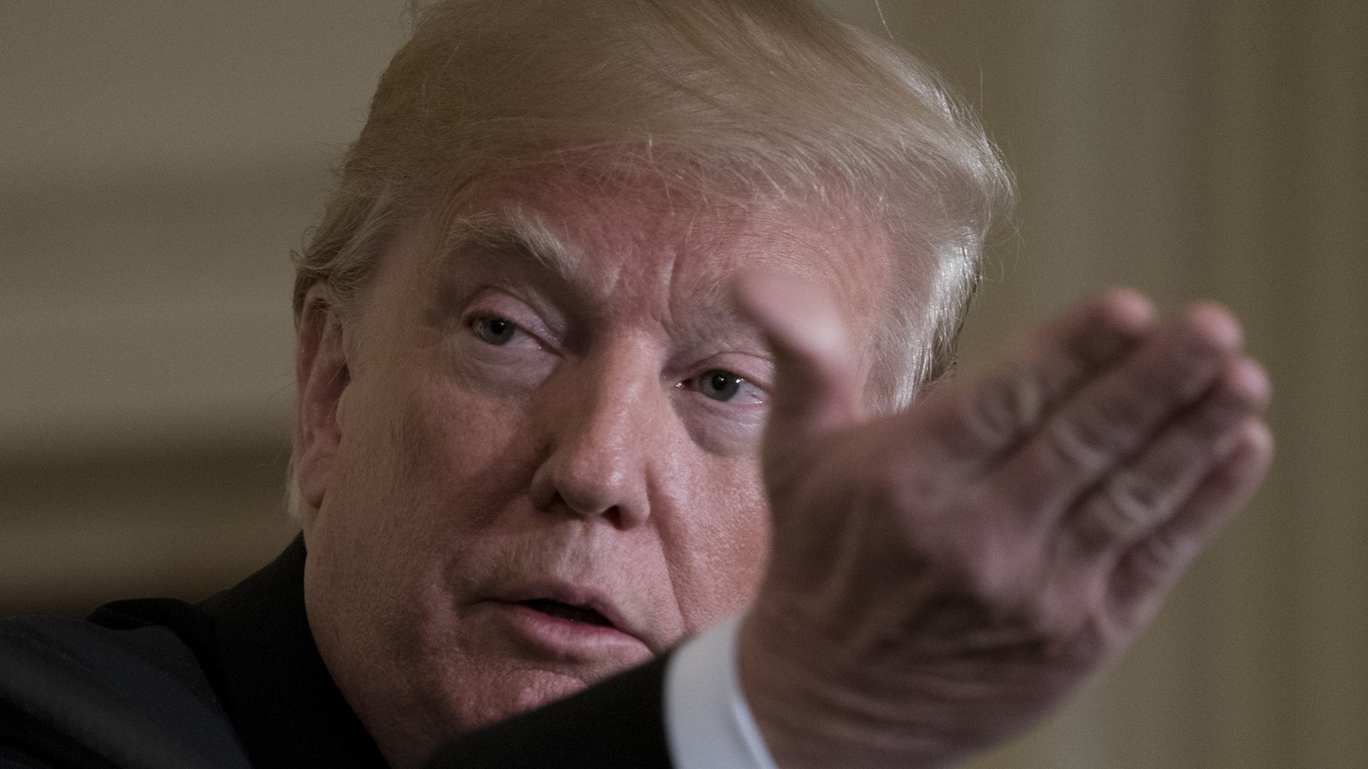 President Donald Trump speaks at a news conference with leaders of Baltic states in the East Room of the White House in Washington, Tuesday, April 3, 2018. Trump is pointing to a 50 percent job approv ...