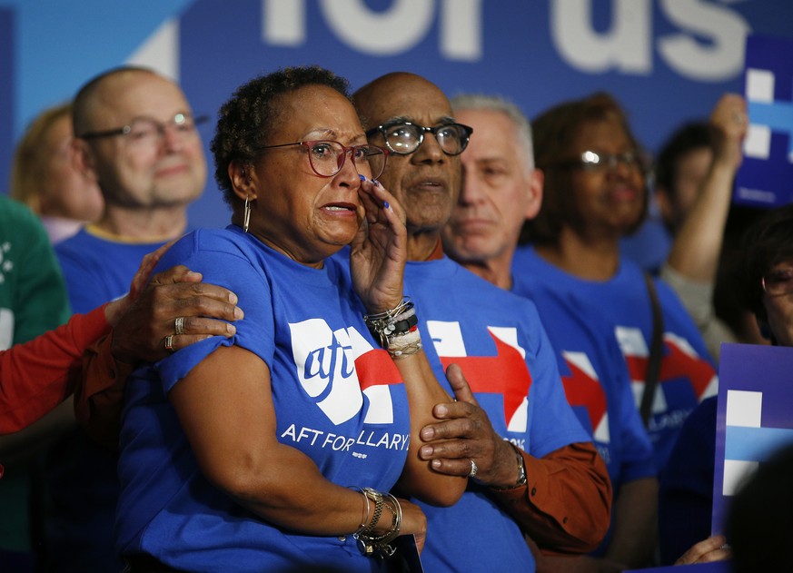 A woman cries as she listens to Democratic presidential candidate Hillary Clinton speak at a United Food and Commercial Workers International Union hall, Wednesday, May 25, 2016, in Buena Park, Calif. ...