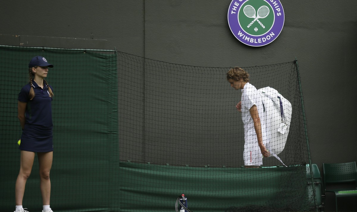 Germany's Alexander Zverev leaves the court after losing to Czech Republic's in a Men's singles match during day one of the Wimbledon Tennis Championships in London, Monday, July 1, 201 ...