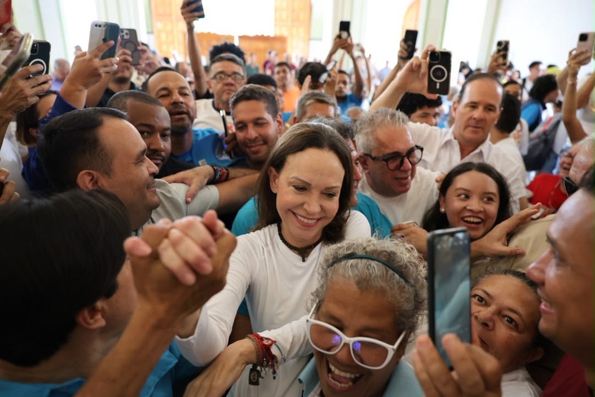 In this photo released by Vente Venezuela Press Office, Venezuelan opposition leader Maria Corina Machado greets supporters at a church in Barquisimeto, Venezuela, Sunday, Oct. 25, 2026. (Vente Venezu ...