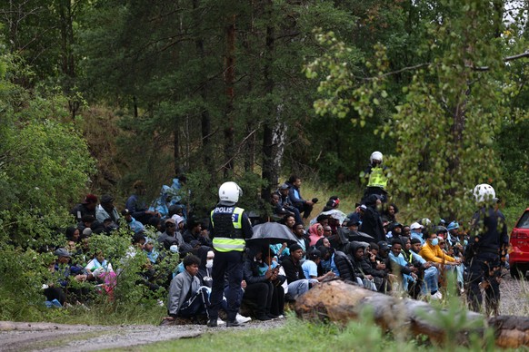 epa10783126 Police deployed following riots that broke out at the Eritrean cultural festival Eritrea Scandinavia at Jaervafaeltet in northern Stockholm, Sweden, 03 August 2023. The festival, running s ...