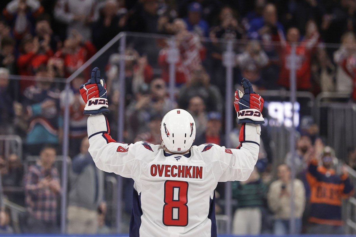 Washington Capitals left wing Alex Ovechkin (8) celebrates after scoring his 895th career goal during the second period of an NHL hockey game against New York Islanders in Elmont, N.Y., Sunday, April  ...