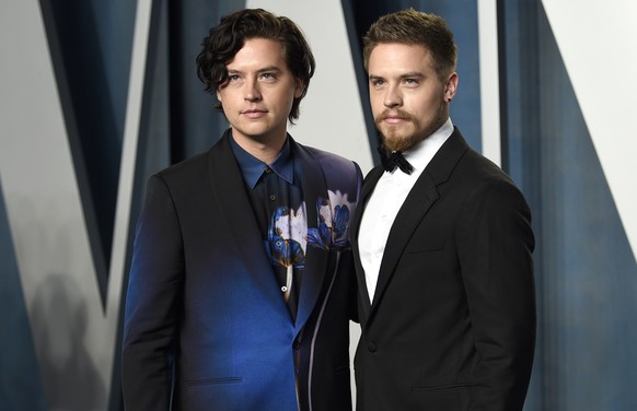 Cole Sprouse, left, and Dylan Sprouse arrive at the Vanity Fair Oscar Party on Sunday, March 27, 2022, at the Wallis Annenberg Center for the Performing Arts in Beverly Hills, Calif. (Photo by Evan Ag ...