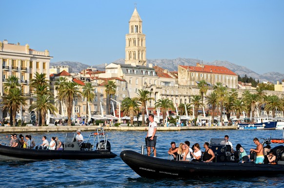epa06171526 A taxi boat operates in the port of Split, Croatia, 30 August 2017. Ride-sharing company Uber launched an on-demand boat service under the name UberBOAT in July 2017 at the Dalmatian coast ...