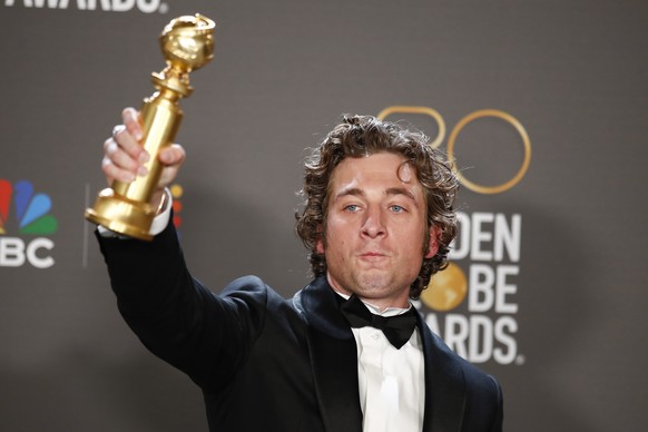 epa10399265 American actor Jeremy Allen White poses with the award for Best Actor in a Television Series, Musical or Comedy in the press room during the 80th Annual Golden Globe Awards Ceremony in Beverly Hi...