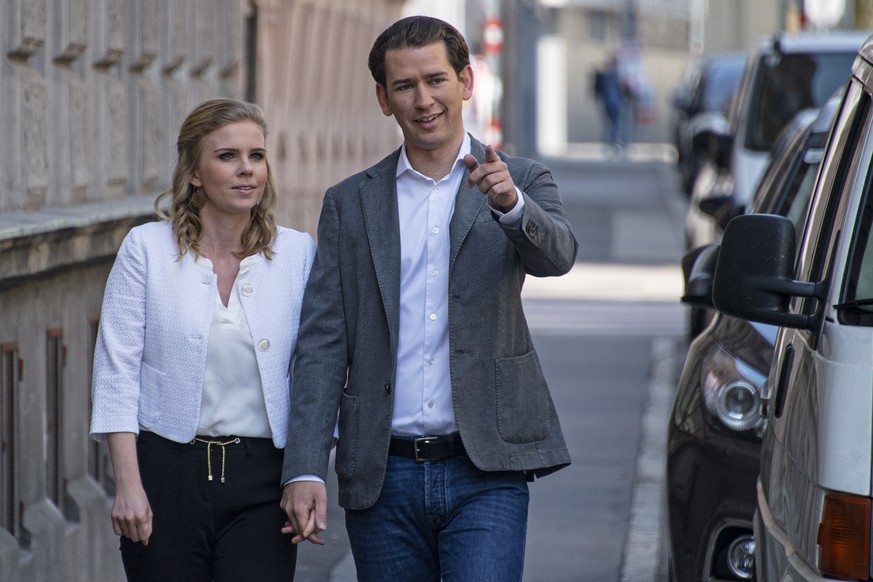 epa07601743 Austrian Chancellor Sebastian Kurz arrives with his girlfriend Susanne Thier at a polling station to cast their votes during the European elections in Vienna, Austria, 26 May 2019. The Eur ...