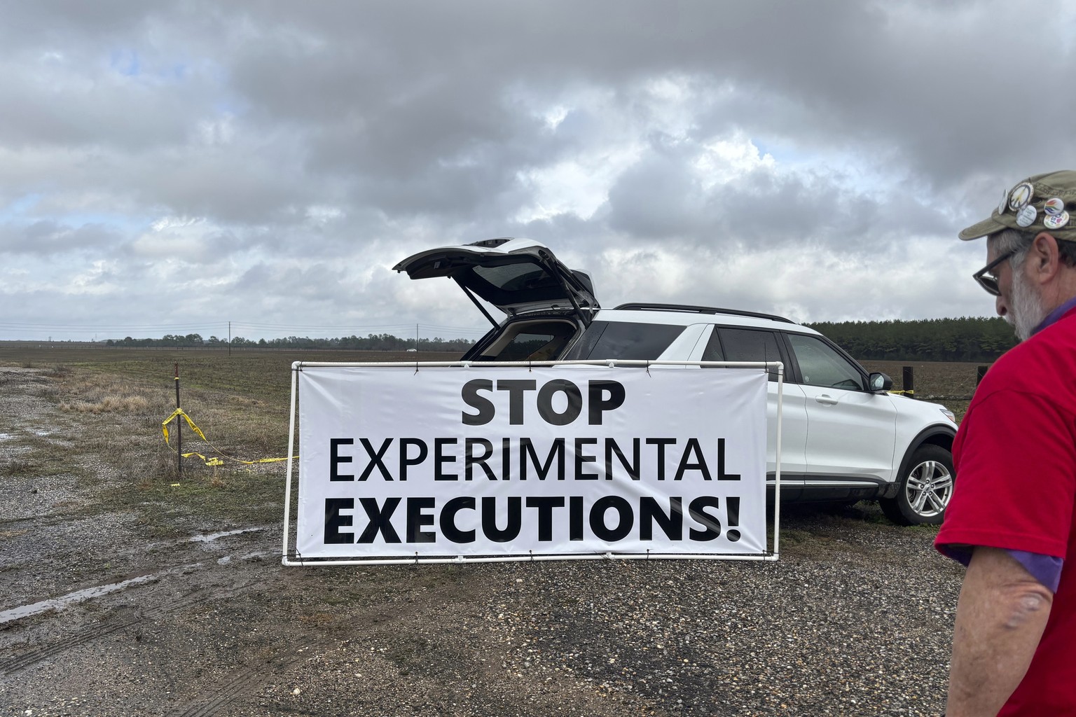 Anti-death penalty activists place signs along the road heading to Holman Correctional Facility in Atmore, Ala., ahead of the scheduled execution of Kenneth Eugene Smith on Thursday, Jan. 25, 2024. Th ...